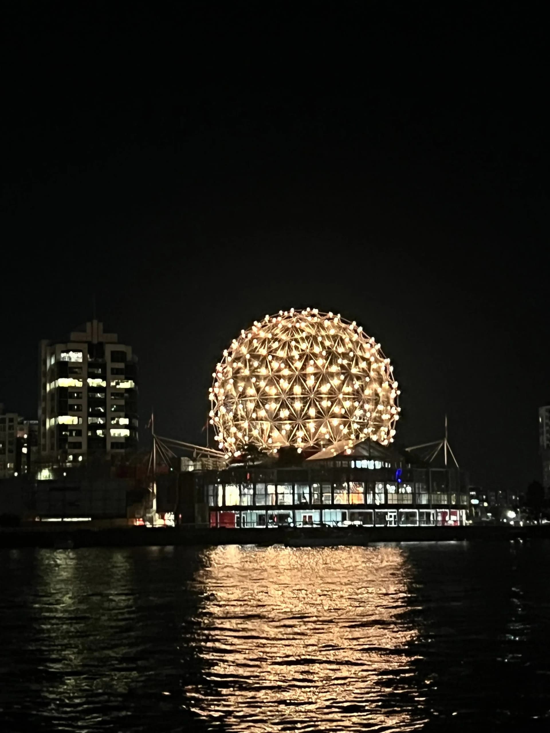 Science World lit up at night after a False Creek sunset cruise